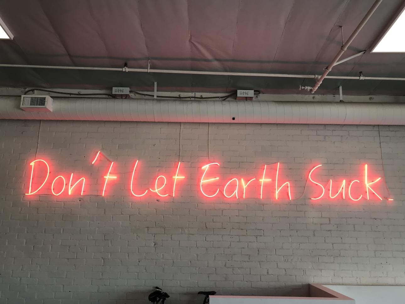 Our unofficial motto, blazing in the lobby at HQ